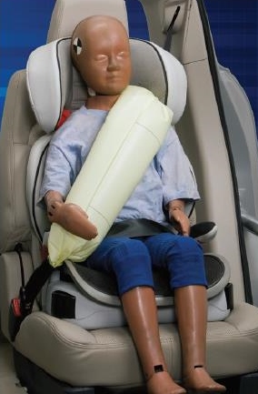 This is a child in a booster seat using the Ford inflatable seat belt.